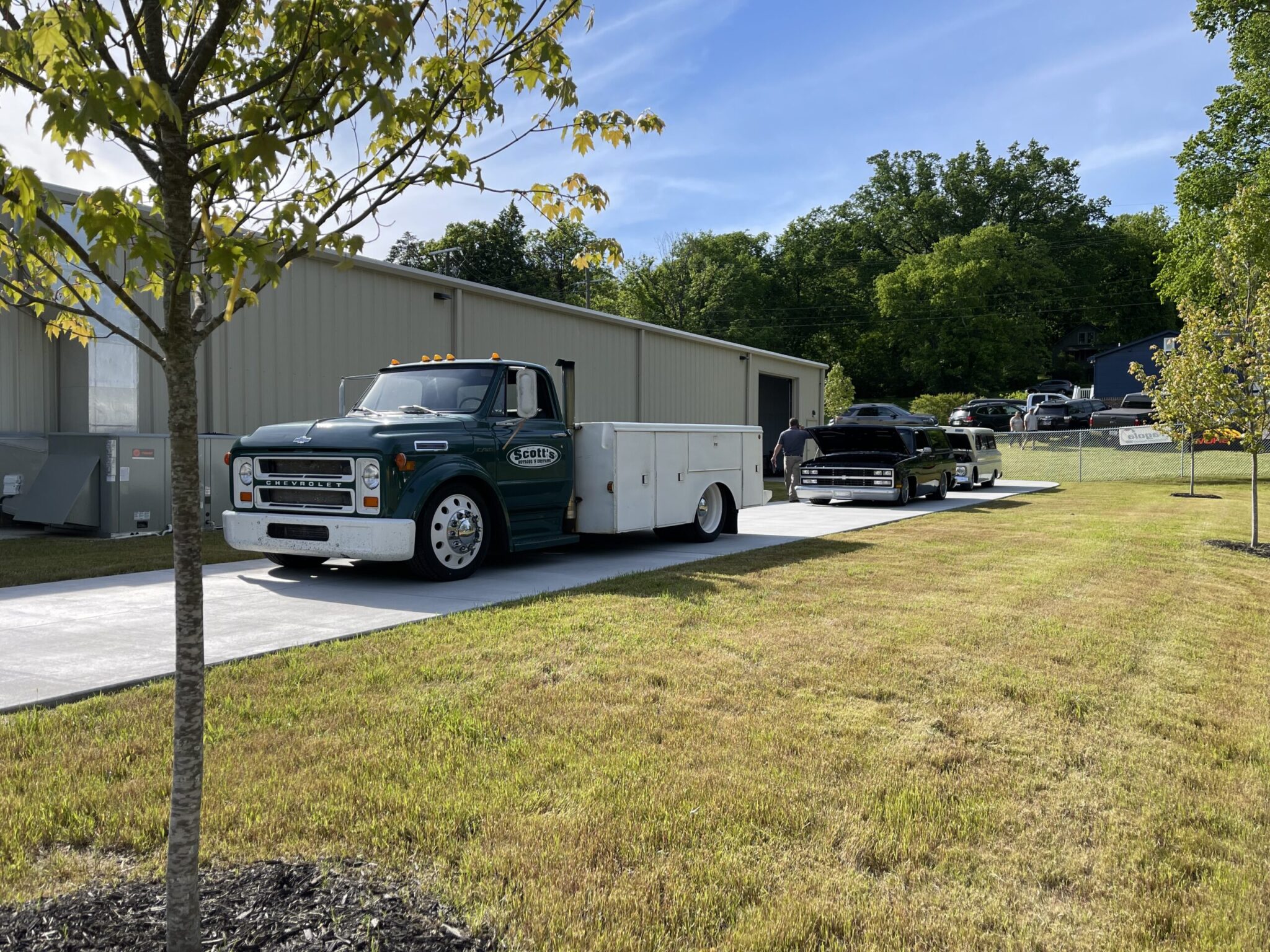 Visitors walking through shop at Scott’s Hotrods open house event in Knoxville